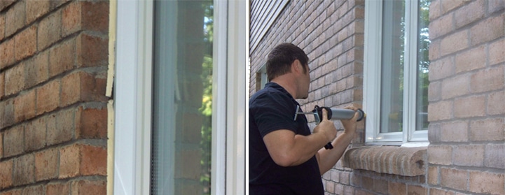 Technician caulking a window on a brick façade